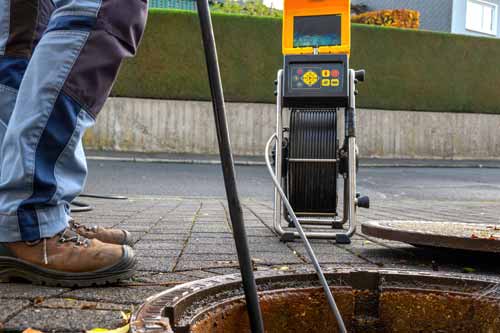 Hose in sewer hole